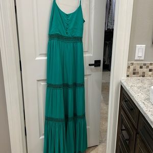 Green sundress with cutouts.
